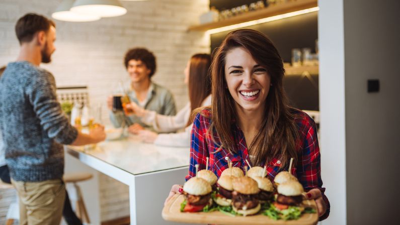 Woman serving burgers Ideas to bring people through food